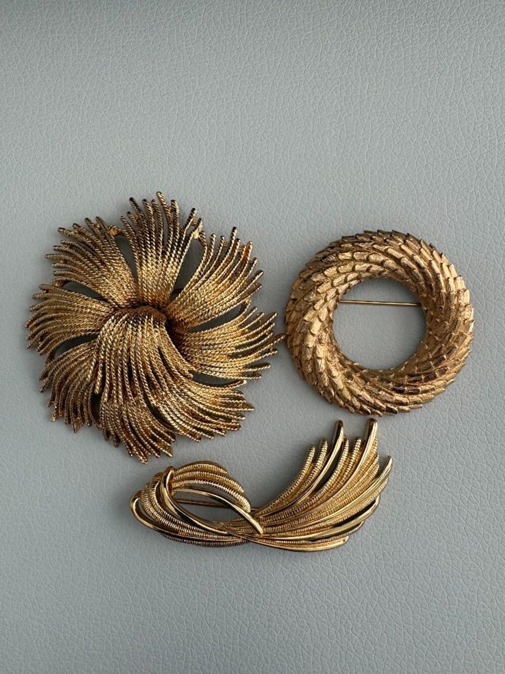 Three Vintage Gold Tone Signed Monet Brooches